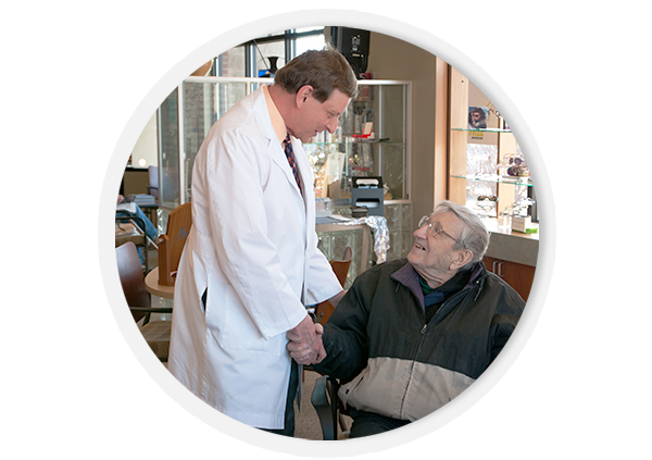 Dr. David Dufeck with an elderly client.